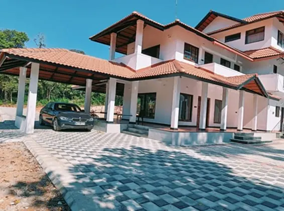 The GreenStay villa with terracotta roofs and paved courtyard