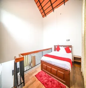 Loft bedroom with wooden ceiling
