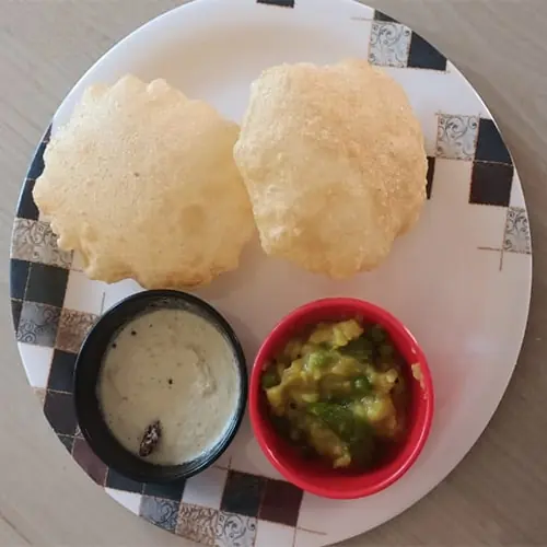 Poori with potato palya and chutney, home-cooked breakfast